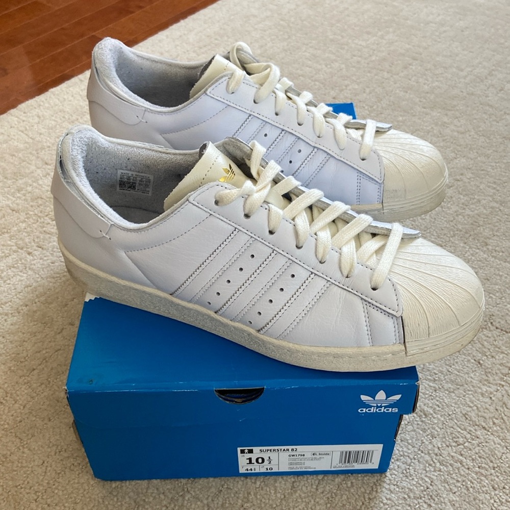 Adidas Superstar 82.  Off-white sole and shell with white stripes and sidewall.